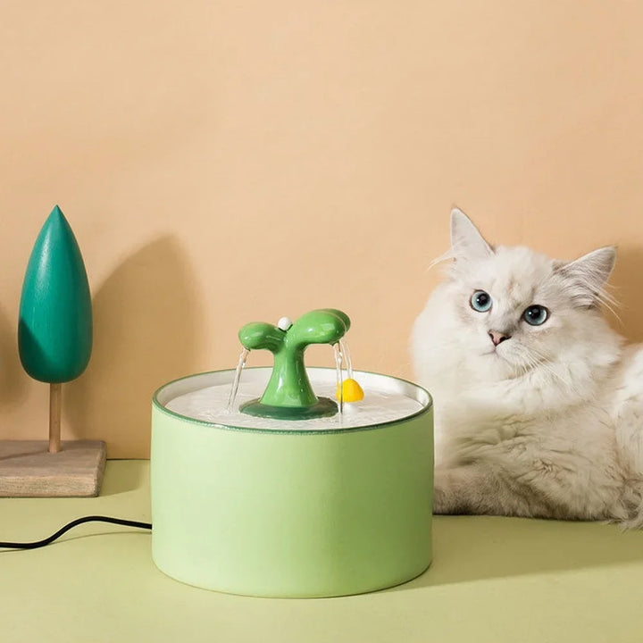 Fontaine à eau pour chat, design vert, en plastique, avec jets d'eau apaisants.