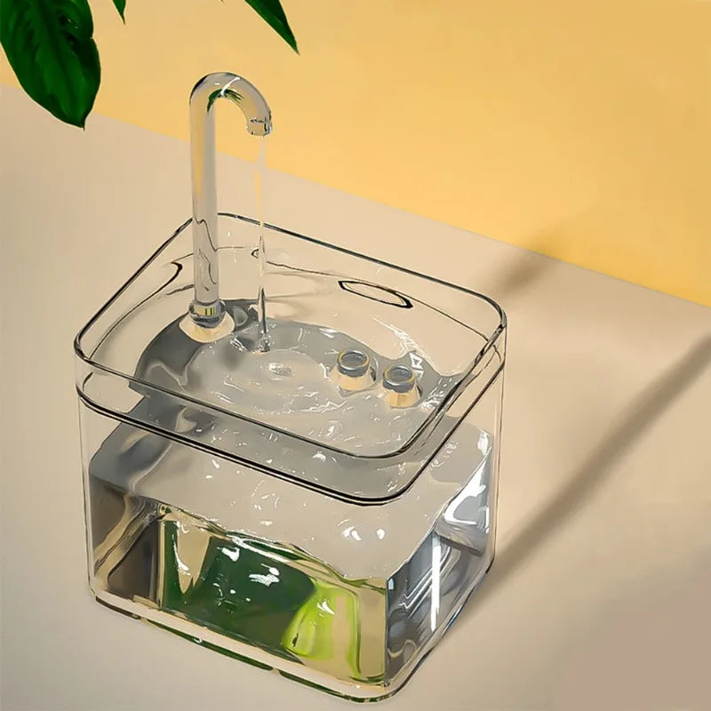 Fontaine d'eau en verre transparent avec robinet, design moderne et élégant pour décoration intérieure.