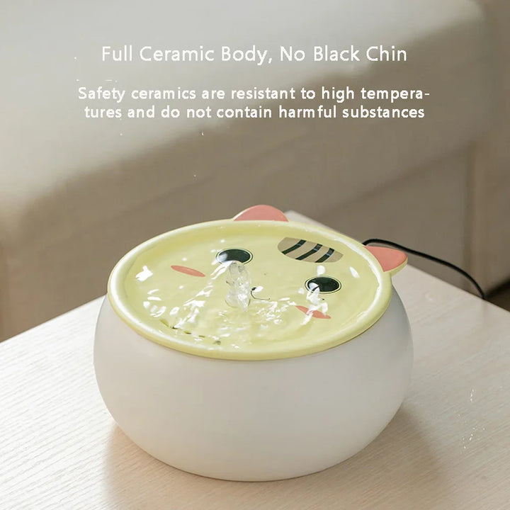 Fontaine à eau en céramique, design mignon, résistant aux hautes températures, couleur blanche et jaune.