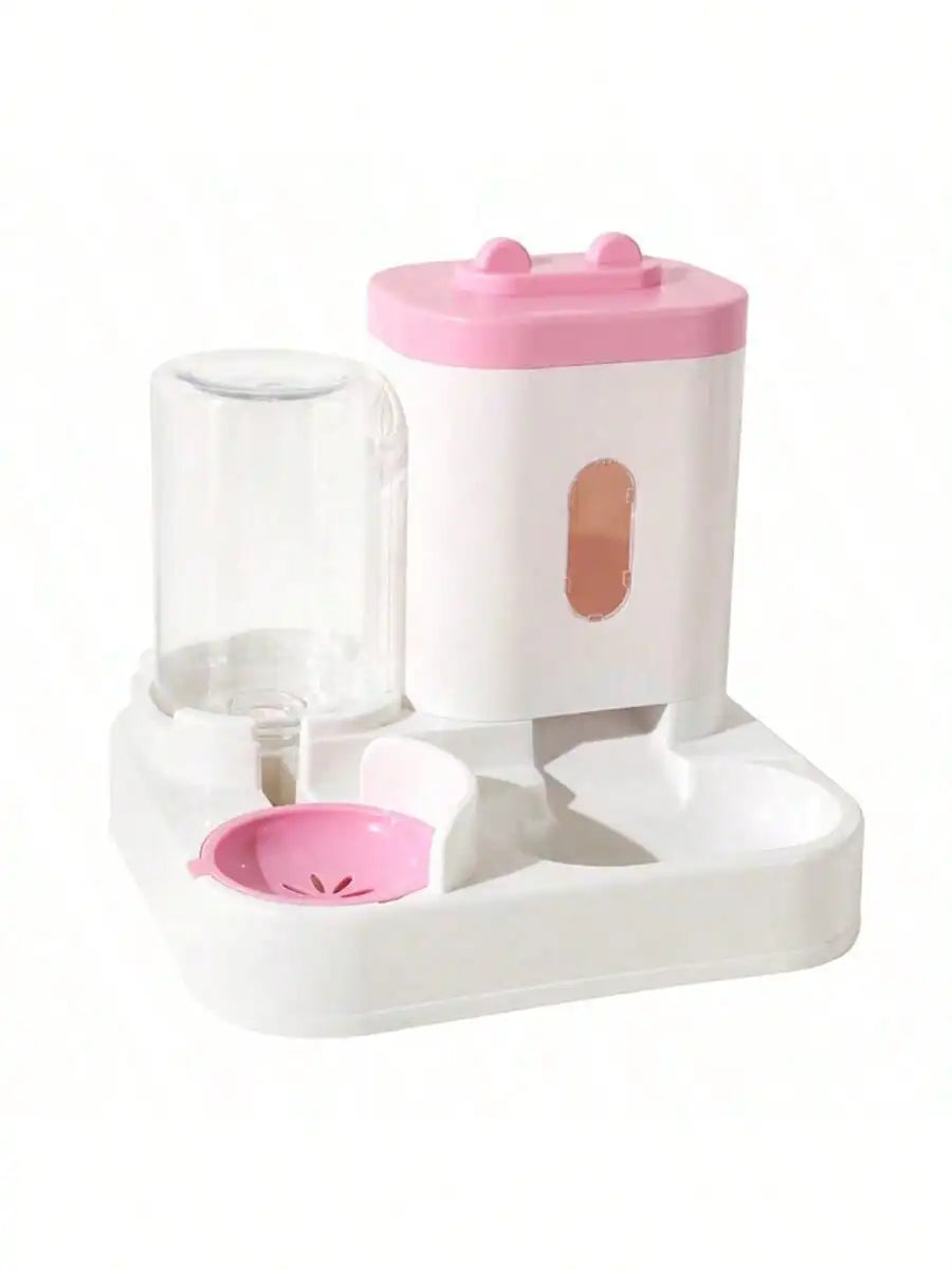 Distributeur d'eau pour animaux, rose et blanc, en plastique, avec réservoir transparent et bol intégré.