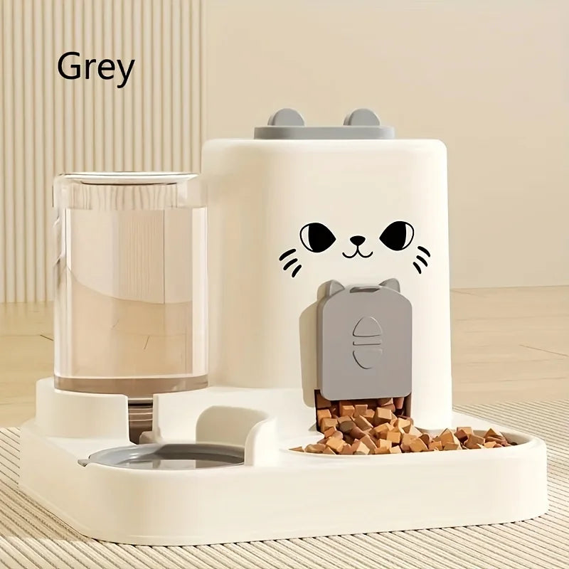 Distributeur automatique pour chat, gris, en plastique, avec réservoir et gamelle intégrés.